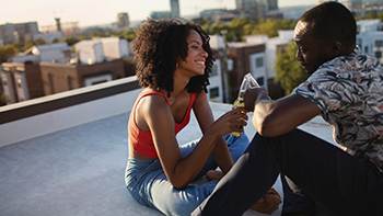 Couple sitting on roof