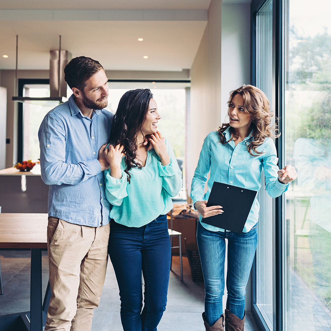 Couple Touring a House With a Real Estate Agent