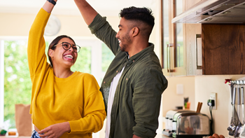 couple dancing in a kitchen