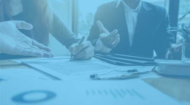 People in business meeting, talking and writing