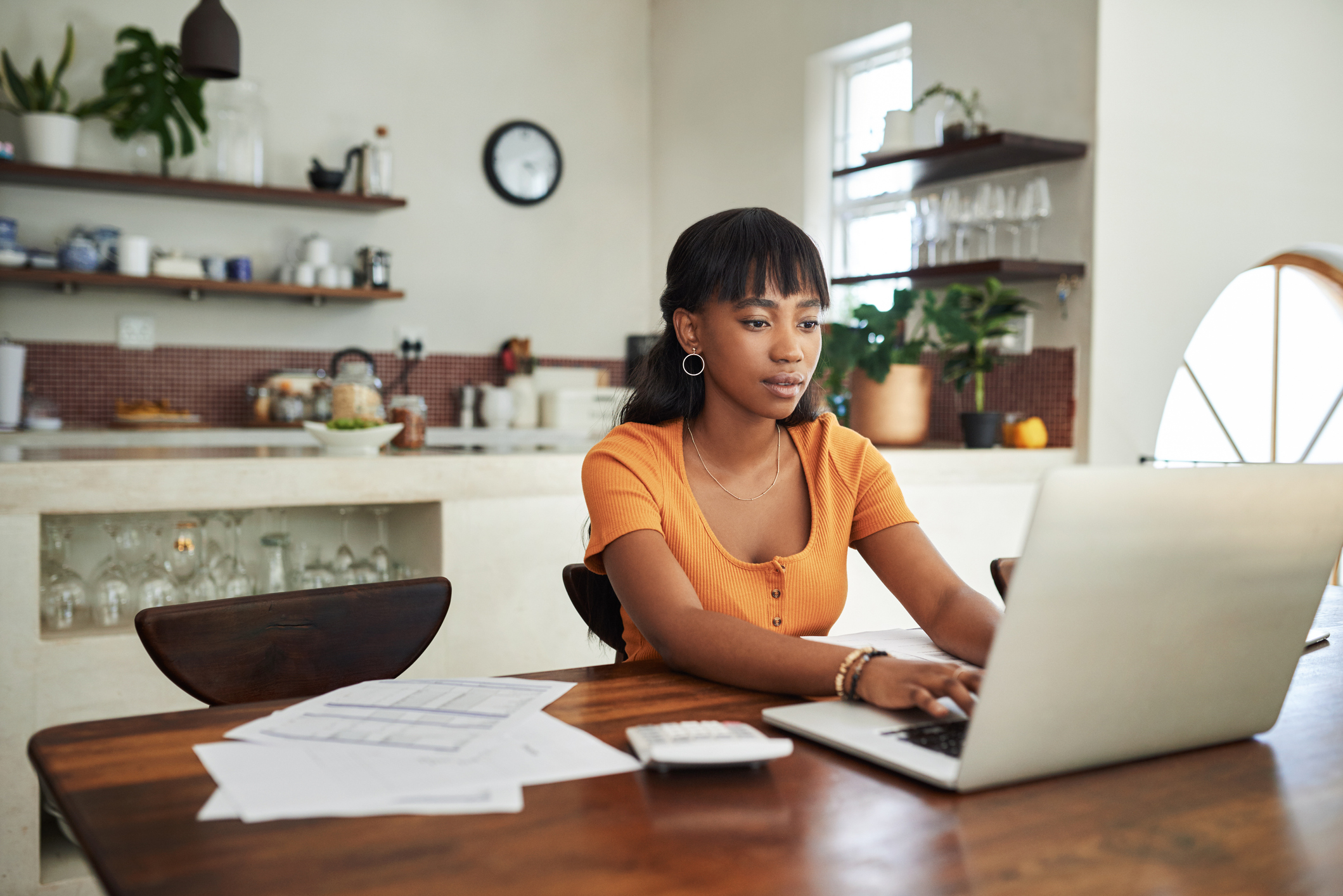 Woman typing on laptop