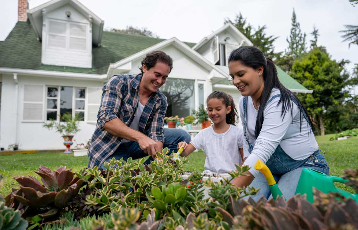 Family gardening in yard