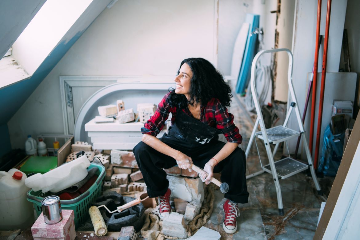 Woman painting room blue